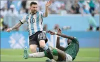  ?? (AFP) ?? Argentina’s forward Lionel Messi is tackled by Saudi Arabia’s defender Hassan Altambakti during their FIFA World Cup Qatar 2022 at the Lusail Stadium on Tuesday.