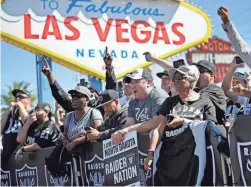  ?? JOHN LOCHER/AP ?? Fans cheer as the Raiders announce their fourth-round NFL draft pick during a 2017 draft event in Las Vegas.