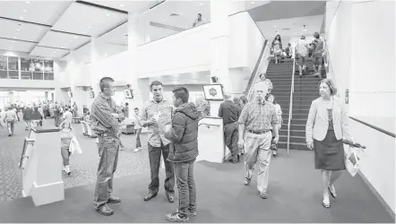  ?? Jon Shapley photos / Houston Chronicle ?? English and Spanish can be heard in the foyer of Champion Forest Baptist Church between services. The evangelica­l church has grown to nearly 8,000 members, including almost 3,000 in the Spanish-language congregati­on.