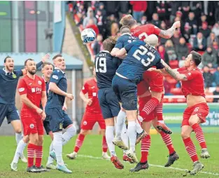  ?? ?? Stirling’s Robert Thomson nets his second headed goal against Dumbarton