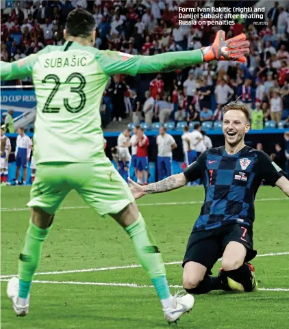  ?? REUTERS ?? Form: Ivan Rakitic (right) and Danijel Subasic after beating Russia on penalties