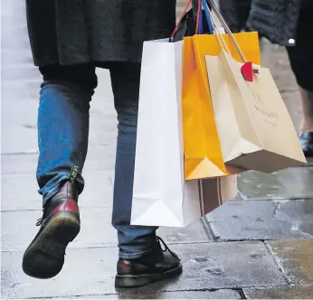  ?? Picture: Bloomberg ?? BE THRIFTY. Savings experts are again warning against unchecked consumer spending ahead of another season of Christmas shopping.