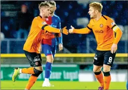  ??  ?? LEVELLER: United scorer King (left) is hailed by team-mate Fraser Fyvie