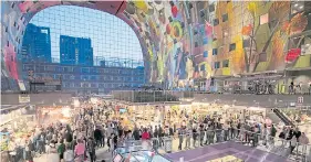  ??  ?? CULTURAL HUB: The Markthal houses shops and eateries under a painted ceiling