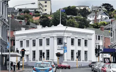  ?? PHOTO: PETER MCINTOSH ?? Formally opened . . . The Dhammachai Internatio­nal Research Institute, in the former BNZ building in Dunedin.