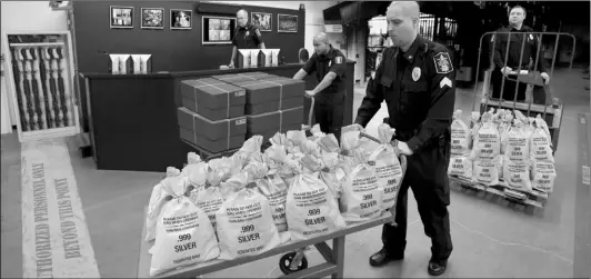  ??  ?? U.S. RESIDENTS CASH IN: It’s like a modern day Gold Rush. Everyone’s scrambling to get their hands on the heavy, Jumbo Silver Ballistic Bags pictured above before they’re all gone. That’s because residents who find the first 2 digits of their zip code printed in today’s publicatio­n are cashing in on the lowest ever State Minimum price set for the next 2 days by the Federated Mint.