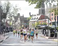  ?? Brian Pounds / Hearst Connecticu­t Media ?? Yale University provides a scenic backdrop for the 2019 Faxon Law New Haven Road Race.