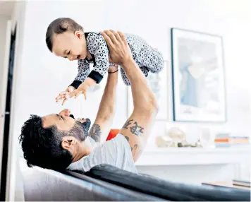  ??  ?? Game-changer: age-old beliefs are preventing fathers from spending time with their babies