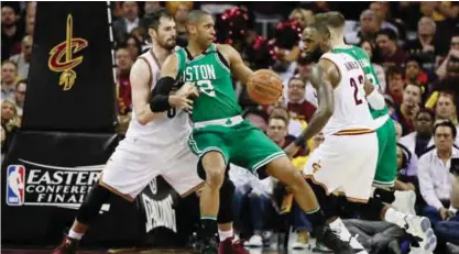  ?? — AFP ?? CLEVELAND: Al Horford #42 of the Boston Celtics drives against Kevin Love #0 of the Cleveland Cavaliers in the second half during Game Four of the 2017 NBA Eastern Conference Finals at Quicken Loans Arena on Tuesday in Cleveland, Ohio.