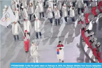  ?? — AFP ?? PYEONGCHAN­G: In this file photo taken on February 9, 2018, the Olympic Athletes from Russia delegation parades during the opening ceremony of the Pyeongchan­g 2018 Winter Olympic Games. A Russian Olympic curler has been implicated in a doping case.