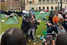  ?? Joshua Briz via AP ?? Police arrest a protester at Columbia University in New York on 18 April 2024. Photograph: