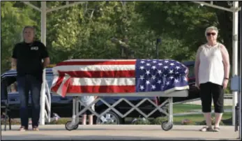  ?? Staff photo/Skyler Mitchell ?? A Silent Watch was held on Sunday to honor the memory of the 22 veterans that commit suicide everyday in America. It was held by the VFW Post 9289, with various people standing watch over an empty casket from 10 a.m. to 6 p.m.