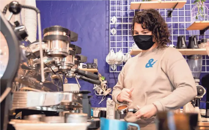  ?? MAX GERSH / THE COMMERCIAL APPEAL ?? Katie Wells prepares a Gingerbrea­d Affoga-dough on Thursday, Nov. 19 at City & State in Memphis.