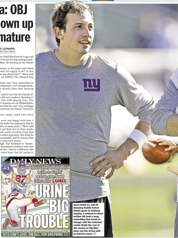  ?? AP ?? Davis Webb (l.) and Eli Manning huddle before Giants game in Oakland Sunday, a contest in which neither QB took a snap, something that needs to change with the untested rookie Webb the rest of the season as Big Blue plays out the string with an interim...