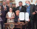  ?? GETTY IMAGES ?? President Donald Trump signs the Great American Outdoors Act during a signing ceremony Tuesday.