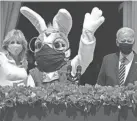  ?? EVAN VUCCI/AP FILE ?? President Joe Biden appears with first lady Jill Biden and the Easter Bunny on the Blue Room balcony at the White House on April 5, 2021. The White House Easter Egg Roll is returning Monday after a 2-year, COVID-induced hiatus.