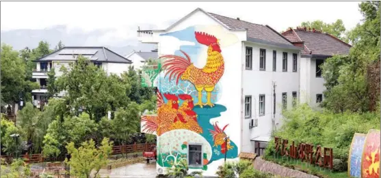  ?? CHINA DAILY PROVIDED TO CHINA DAILY ?? The iconic mural Roosters is the landmark of Yudong village in the city of Quzhou, Zhejiang province.