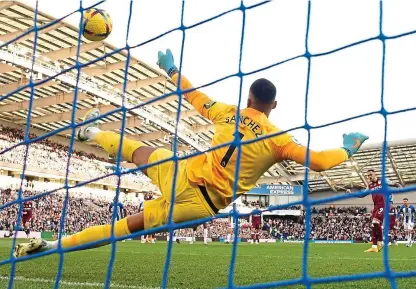  ?? REUTERS ?? Centurion: Danny Ings beats Robert Sanchez from the spot to score his 100th league goal