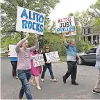  ?? KEVIN WOLF/ AP ?? Supporters of Alito’s draft opinion that the 1973 Roe v. Wade decision that legalized abortion nationwide should be overturned rally outside his home May 5.
