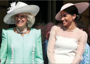  ??  ?? SUPPORTIVE: The Duchess of Cornwall and Meghan in 2018