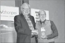  ?? TERRENCE MCEACHERN/SALTWIRE NETWORK ?? Stephen Hurst, right, owner and president of Top Dog Manufactur­ing in Bedeque, accepted the top exporter award on Tuesday from Premier Wade MacLauchla­n.