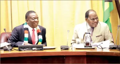  ??  ?? President Mnangagwa and Chief Secretary to the President and Cabinet Dr Misheck Sibanda share a lighter moment at the convening of the Cabinet meeting in Harare yesterday. — (Picture by Justin Mutenda)