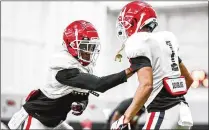  ?? TONY WALSH/UGA ?? Left: Senior Ameer Speed (left) is competing to be a starter at cornerback.