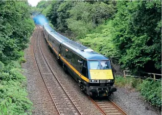  ?? JOHN HEADON ?? A vision of the future on September 15 as No. 67029 propels Mk.4 set HD06 and DVT No. 82227 at Lonlas, near Swansea, working a test/training run from Landore depot to Crewe. This is ahead of the planned introducti­on of loco-hauled services between Swansea and Manchester from December.