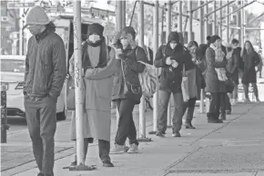  ?? BEBETO MATTHEWS/AP ?? People wait in a line stretching around a block for a clinic offering COVID-19 testing in the Park Slope area of the Brooklyn borough of New York City.