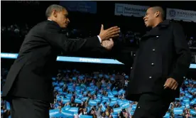  ?? ?? Barack Obama is greeted on stage by Jay-Z in 2012. Photograph: Jason Reed/Reuters