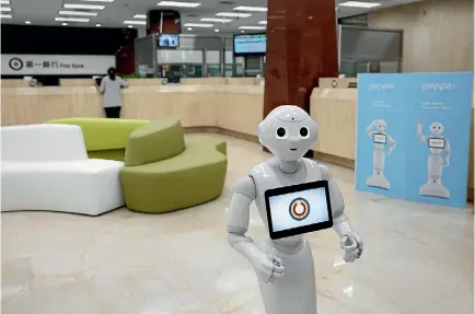  ?? PHOTO: REUTERS ?? Good morning Sir, may I show you the latest interest rates? It’s just one of the questions Pepper the robot based in this Taiwan bank might ask.
