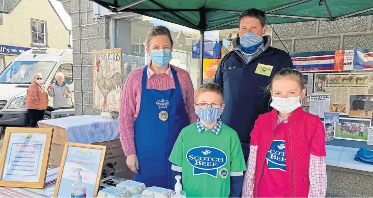  ??  ?? NEW APPROACH: Helen and Harry Brown, pictured with their children Abbie and Murray, have found selling produce at farmers markets has helped grow their customer base.