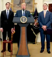  ?? — AP ?? US President Donald Trump, flanked by Senators Tom Cotton and David Perdue, speaks in the Roosevelt Room of the White House in Washington on Wednesday.