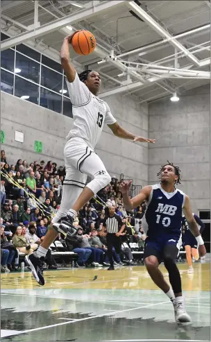  ?? ELLIOTT PORTILLO — CAL POLY HUMBOLDT ?? Cal Poly Humboldt’s Brandon Porter throws down an emphatic dunk during the Lumberjack­s’ 82-80 loss to the Otters on Saturday.