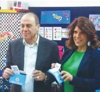  ?? (Facebook) ?? THEN-NATIONAL INFRASTRUC­TURE Minister Silvan Shalom and Judy Shalom Nir Mozes vote in the 2015 Knesset election.