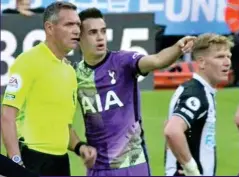  ?? ?? Saviours: Sergio Reguilon alerts Andre Marriner to an incident in the stands, and Dr Tom Prichard talks to the BBC the next day after he helped save a fan’s life