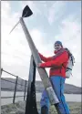  ?? Photograph: Iain Write, The Write Image ?? Mountain Festival chairman Mike Pescod beside one of the giant Ice Axe.