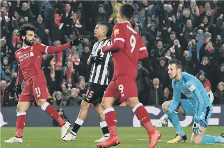  ??  ?? Newcastle keeper Martin Dubravka (right) can only look on as Mo Salah celebrates his Liverpool opener on Saturday.