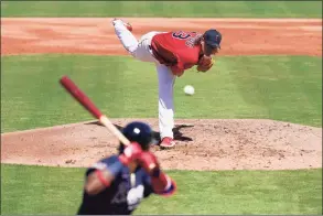  ?? Brynn Anderson / Associated Press ?? Boston Red Sox starting pitcher Garrett Richards throws in the first inning during a spring training game against the Atlanta Braves on Monday in Fort Myers, Fla.