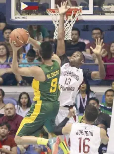  ?? JUN MENDOZA ?? FEU Tamaraw Russel Escoto takes a shot against Cheick Kone of UP in their UAAP game yesterday at the Big Dome.