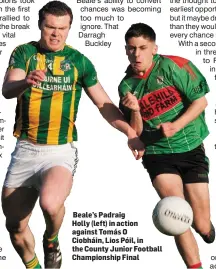  ??  ?? Beale’s Padraig
Holly (left) in action against Tomás O Ciobháin, Lios Póil, in the County Junior Football Championsh­ip Final