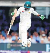  ??  ?? Pakistan's Haris Sohail jumps after hitting the winning runs on Day Four of the first Test at Lord’s cricket ground against England.