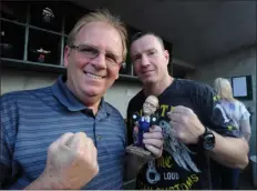  ?? SUN FILE PHOTO — TORY GERMANN ?? Lowell’s Mickey O’keefe, left, and Micky Ward pose in the Lowell Spinners dugout at Lelacheur Park on Aug. 18, 2011. The Spinners honored O’keefe with his own bobblehead doll.