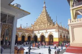  ?? DENIS D. GRAY/AP ?? Mahamuni Monastery in Mandalay, a magnet for pilgrims from all over the country. This Buddhist pagoda exemplifie­s the traditiona­l Burmese character of the city. An image of the Buddha in the monastery is one of the oldest and most revered in Myanmar.