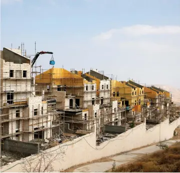  ??  ?? BULIDINGS ARE SEEN last month under constructi­on in the settlement of Ma'aleh Adumim.