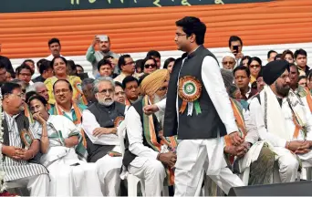  ?? SUBIR HALDER ?? BIG STRIDE Abhishek Banerjee passes by Chief Minister Mamata Banerjee at a public function