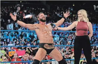  ??  ?? WWE Raw profession­al wrestler Bobby Roode, seen being interviewe­d in the ring by Renee Young, will finally make his Peterborou­gh debut on the Aug. 27 Smackdown Live card at the Memorial Centre.