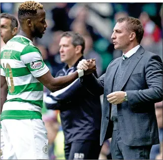  ??  ?? welcome back: Moussa Dembele returned for Celtic in the 4-0 win over Ross County yesterday that helped Brendan Rodgers’ men open up a two-point gap at the top of the table