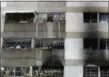  ?? ARIANA CUBILLOS — THE ASSOCIATED PRESS ?? Signs of smoke cover the apartment complex where an allegedly armed drone crashed, causing a fire, in Caracas, Venezuela, Sunday.