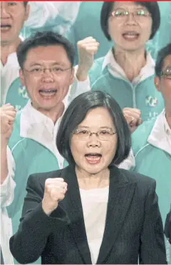  ??  ?? Democratic Progressiv­e Party leader Tsai Ing-wen leads her colleagues in cheers after giving a speech at a party congress in Taoyuan in northern Taiwan.